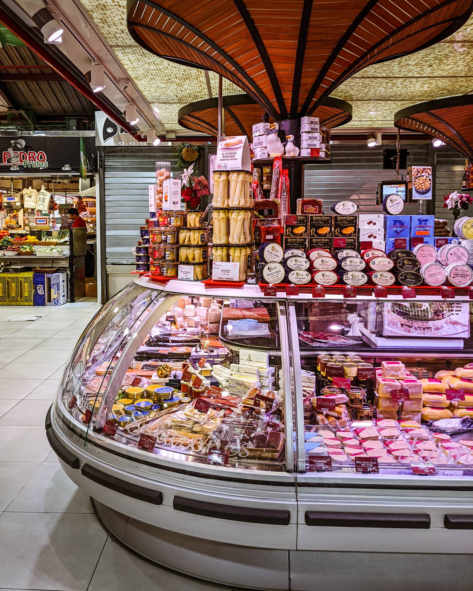 A cheese and meat stall inside Mercado de la Paz