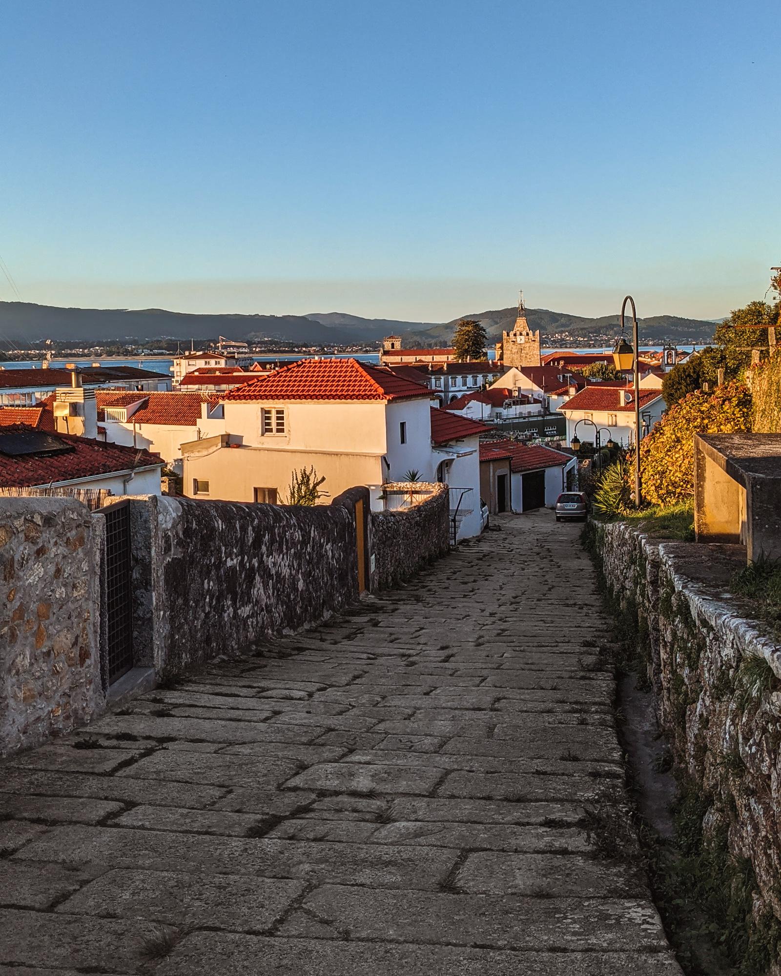 Cobblestone road during golden hour in Caminha, Portugal