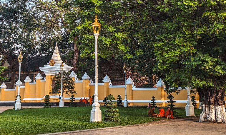 Monks sitting under a tree in Phnom Penh