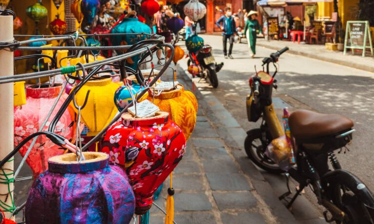 Colorful lanterns being sold on the sidewalk in Hoi An's Old Town