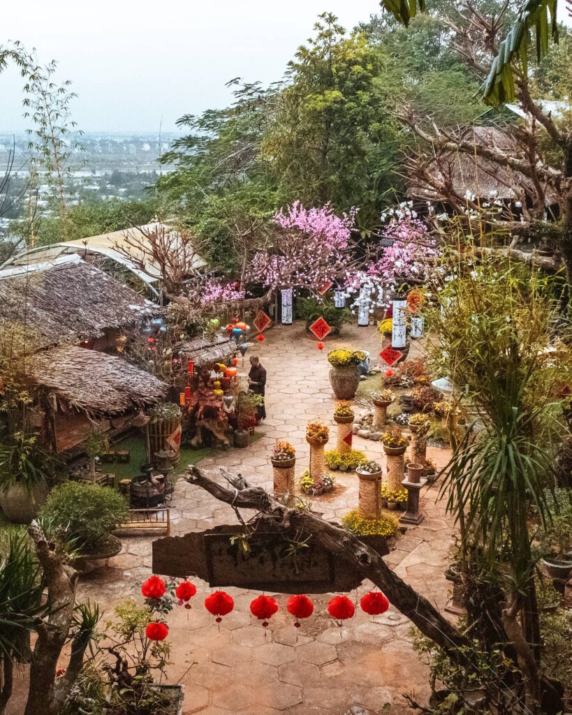 Top-down view of a plaza in the Marble Mountains containing a temple and decorations for Tet