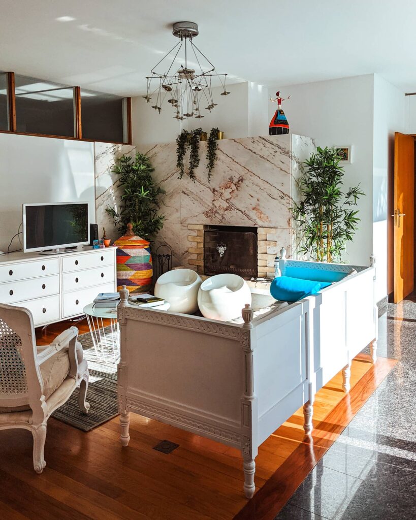 Common area with a couch, TV, and fireplace at Sea Soul Esposende